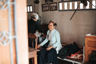 Two elderly women sharing a joyful moment