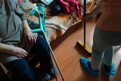 Caregiver helping with household tasks